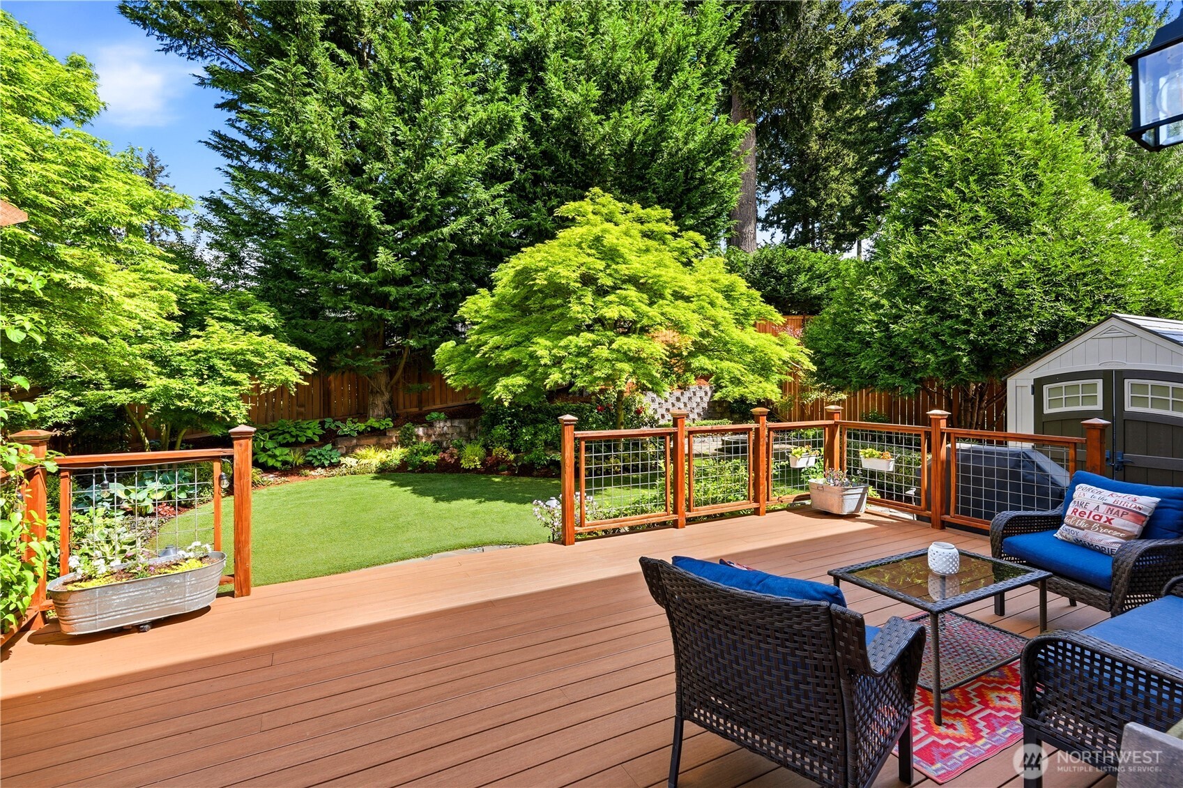 13410 Southeast 252nd Street Kent, WA 98042 - Photo 15 of 38 a view of a chairs and table on the wooden deck