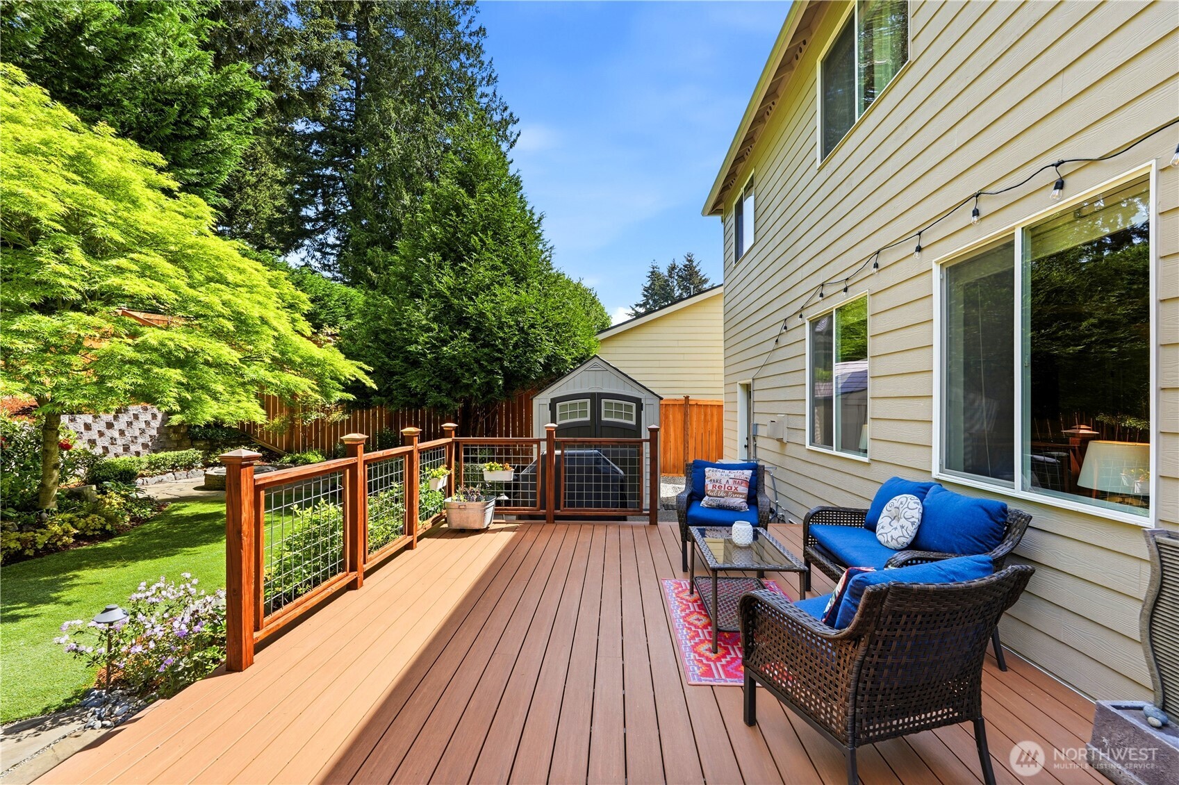13410 Southeast 252nd Street Kent, WA 98042 - Photo 16 of 38 a roof deck with table and chairs and potted plants
