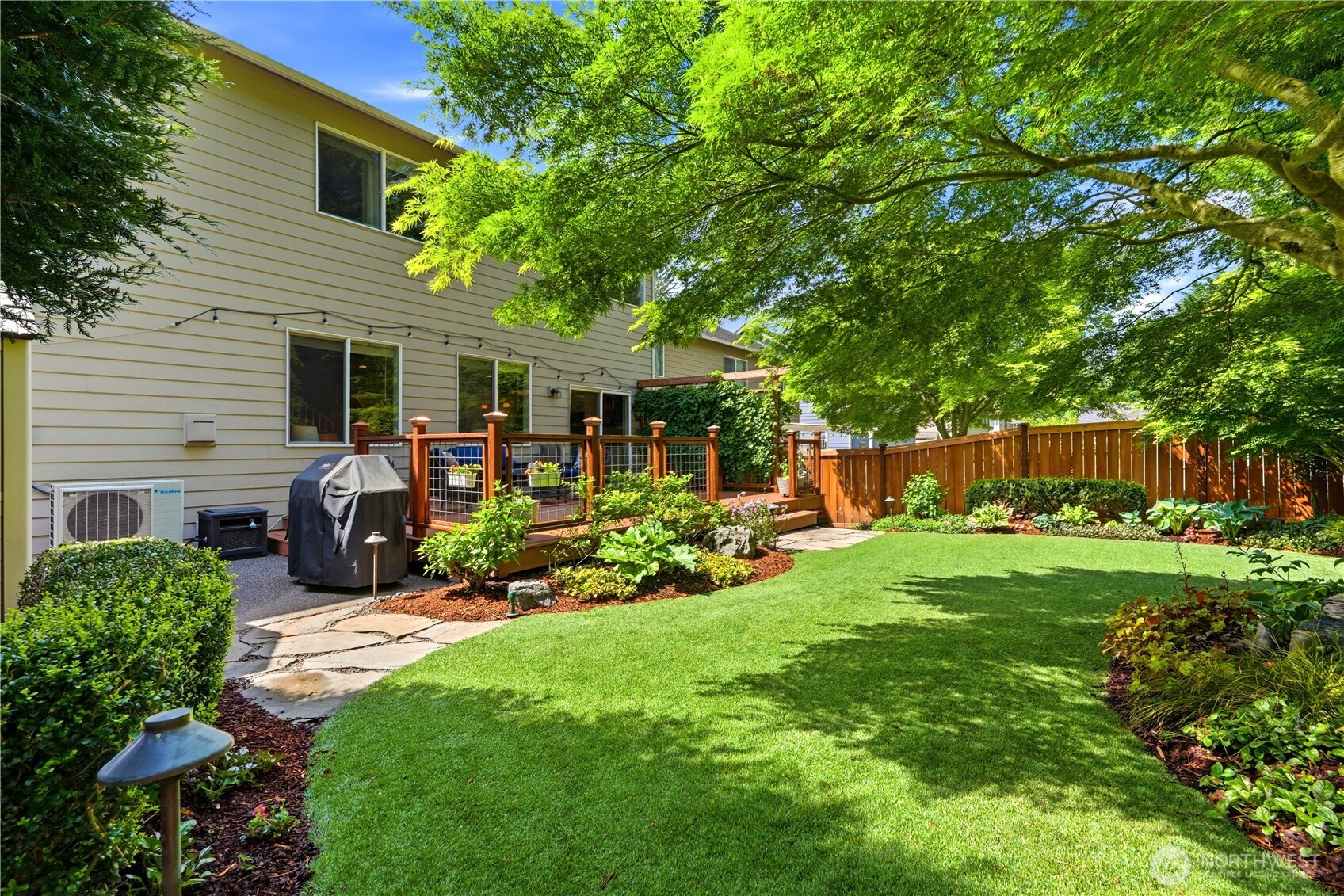 13410 Southeast 252nd Street Kent, WA 98042 - Photo 19 of 38 a front view of a house with patio and garden