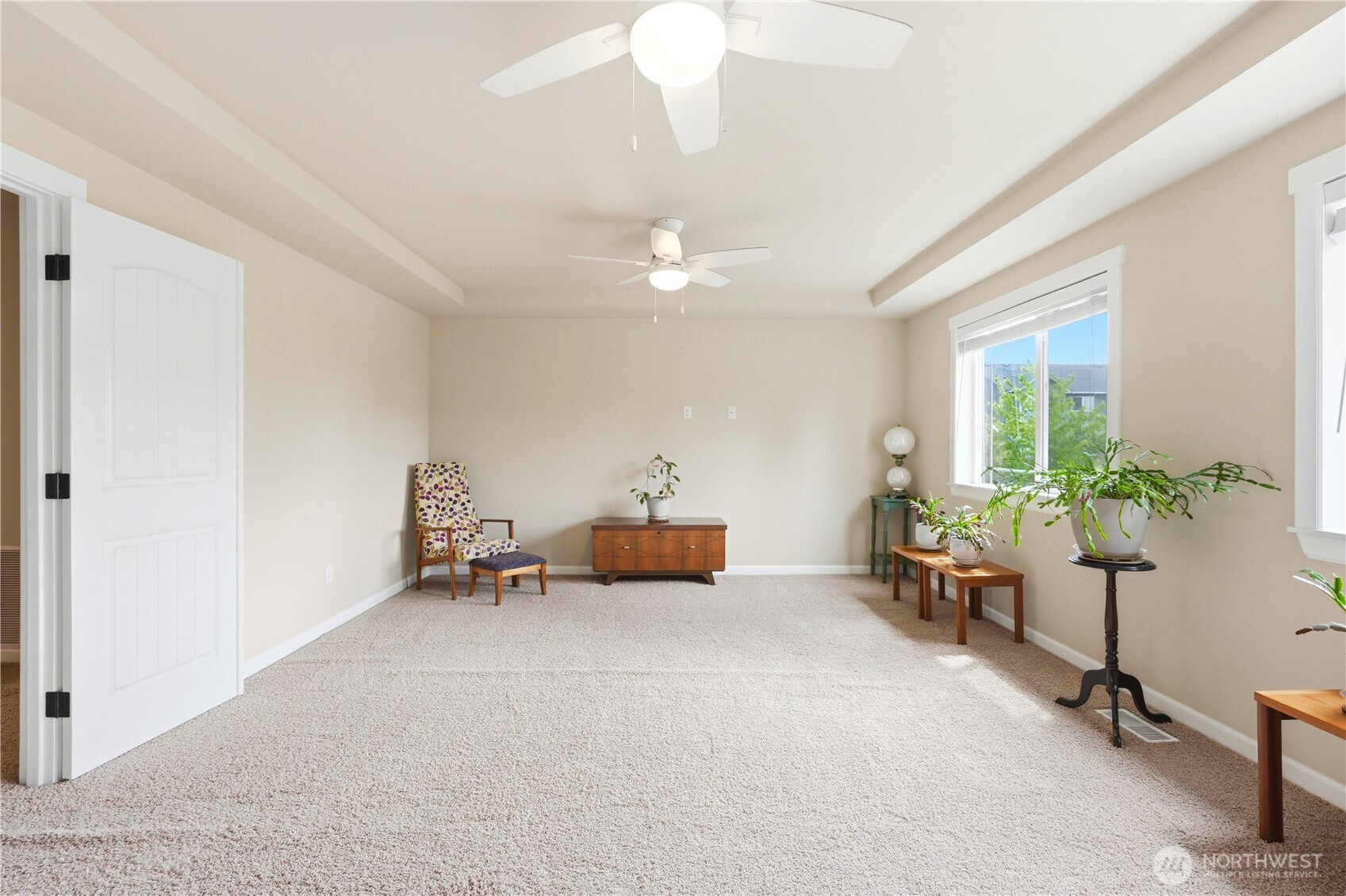 13410 Southeast 252nd Street Kent, WA 98042 - Photo 31 of 38 a living room with furniture and a chandelier