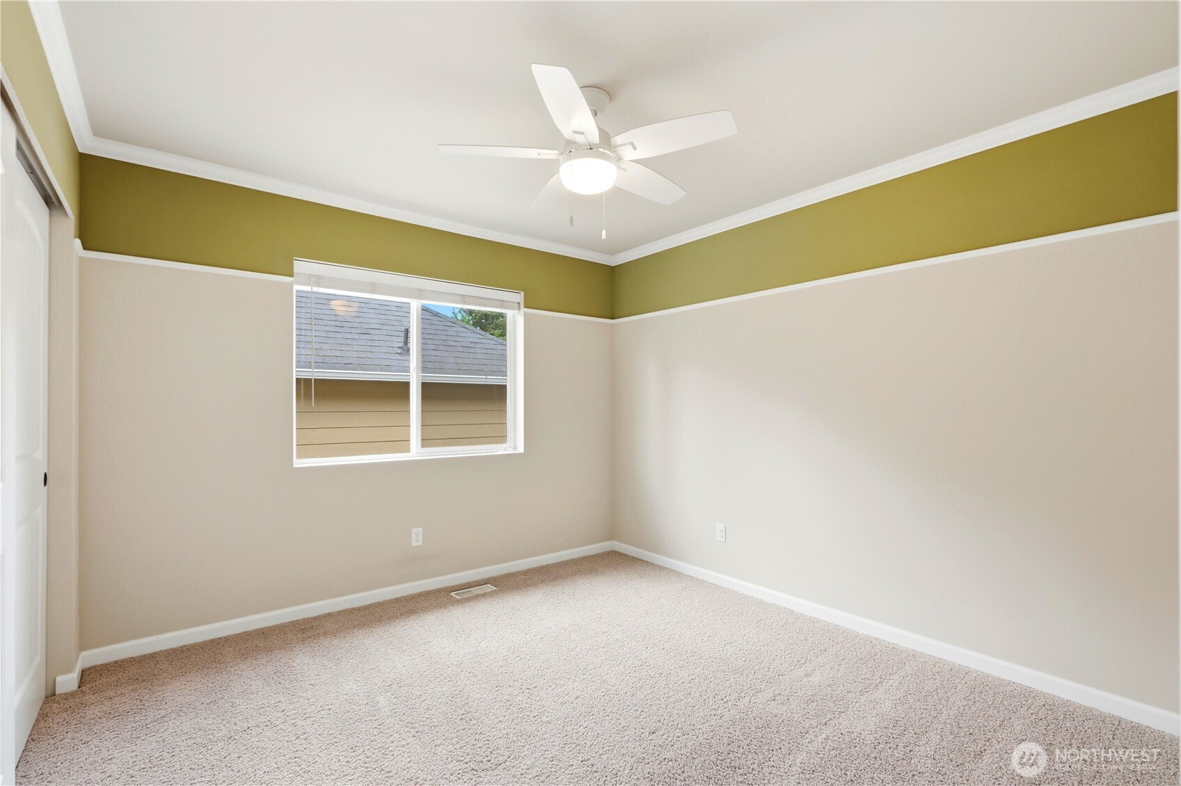 13410 Southeast 252nd Street Kent, WA 98042 - Photo 35 of 38 an empty room with a window and a ceiling fan