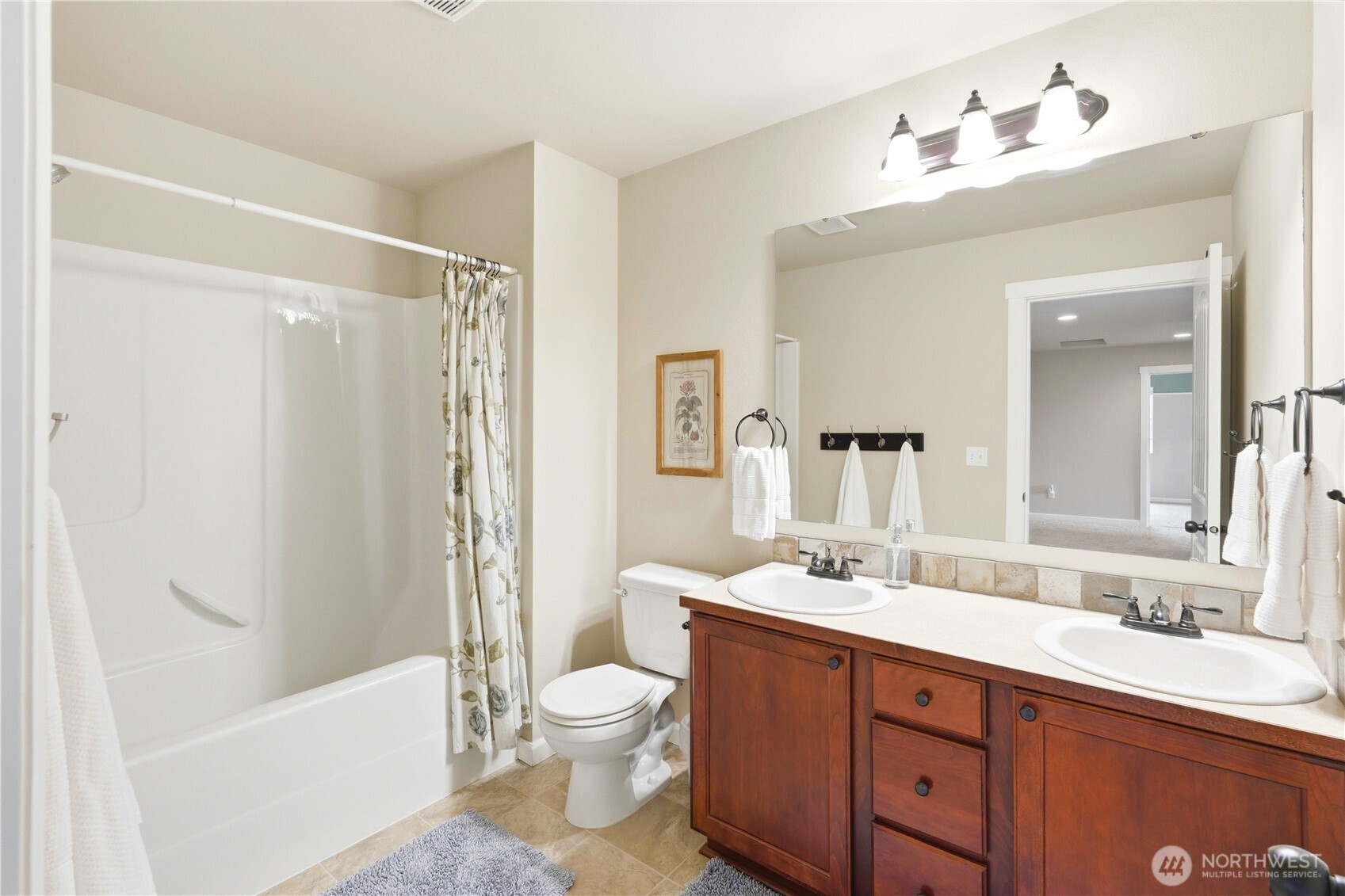 13410 Southeast 252nd Street Kent, WA 98042 - Photo 36 of 38 a bathroom with a double vanity sink toilet mirror and bathtub