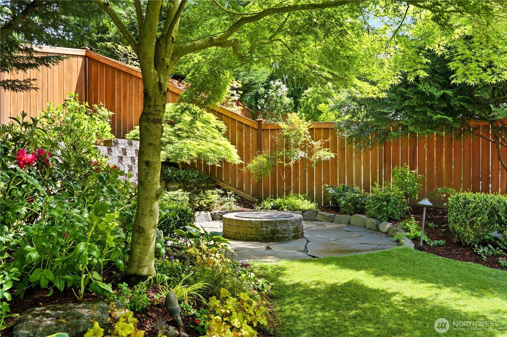13410 Southeast 252nd Street Kent, WA 98042 - Photo 4 of 38 a backyard of a house with table and chairs