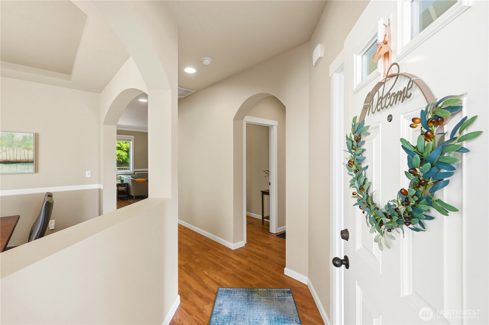 13410 Southeast 252nd Street Kent, WA 98042 - Photo 7 of 38 a view of a hallway with wooden floor and front door