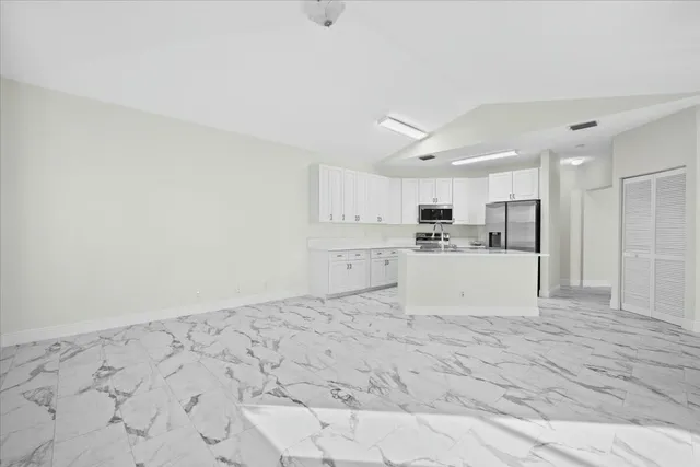 a view of kitchen with wooden floor