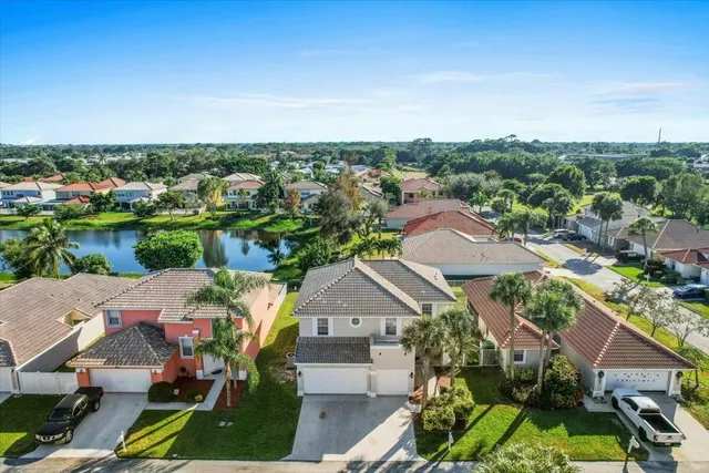 an aerial view of a house with a garden