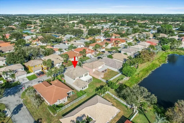 an aerial view of residential houses with outdoor space