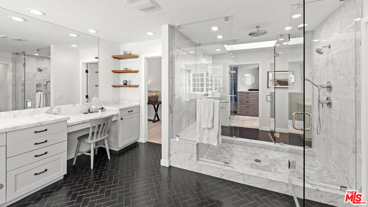 1944 North Beverly Drive Beverly Hills, CA 90210 - Photo 11 of 29 a bathroom with a double vanity sink mirror and shower