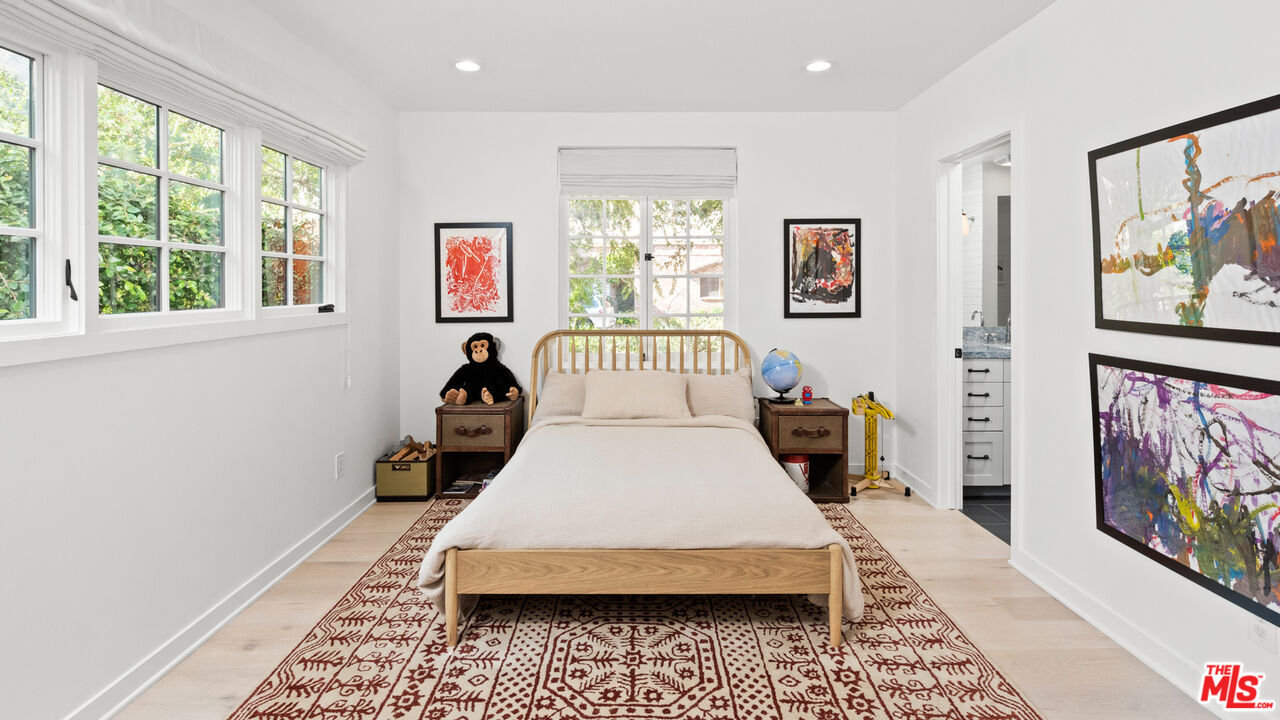 1944 North Beverly Drive Beverly Hills, CA 90210 - Photo 21 of 29 a living room with furniture and a window