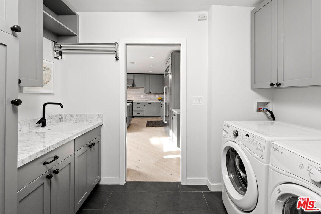 1944 North Beverly Drive Beverly Hills, CA 90210 - Photo 23 of 29 a utility room with cabinets