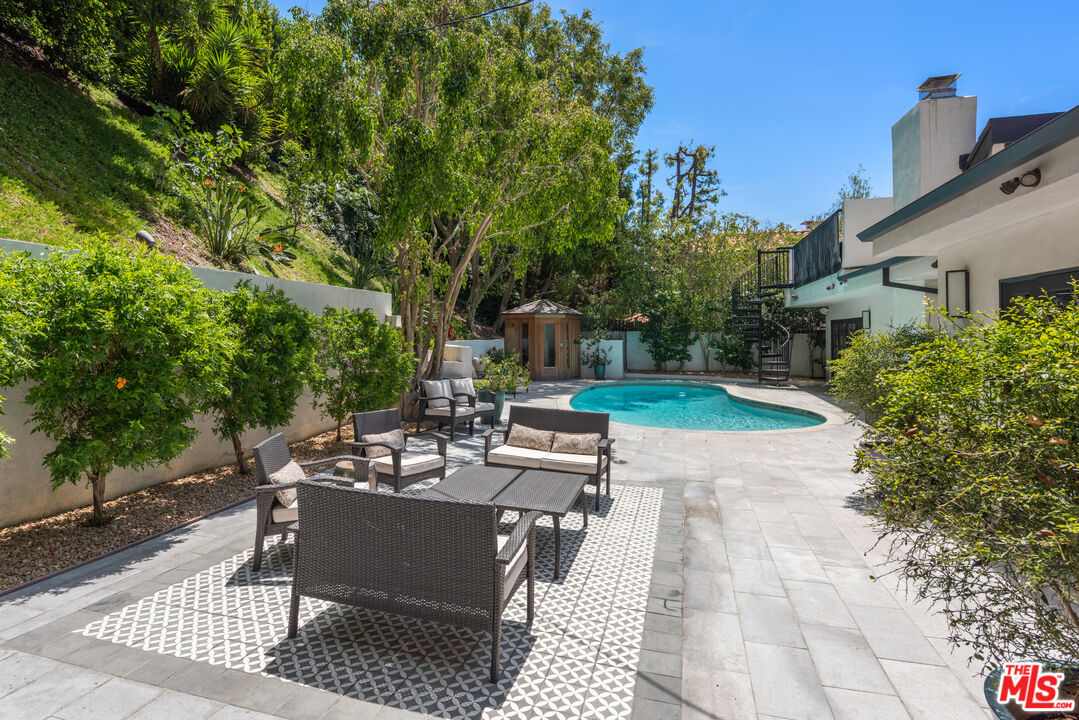 1944 North Beverly Drive Beverly Hills, CA 90210 - Photo 26 of 29 a view of a backyard with sitting area