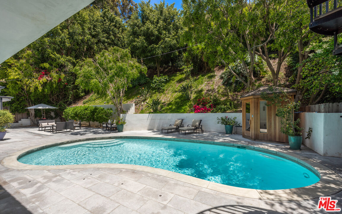 1944 North Beverly Drive Beverly Hills, CA 90210 - Photo 29 of 29 a house view with a sitting space and garden