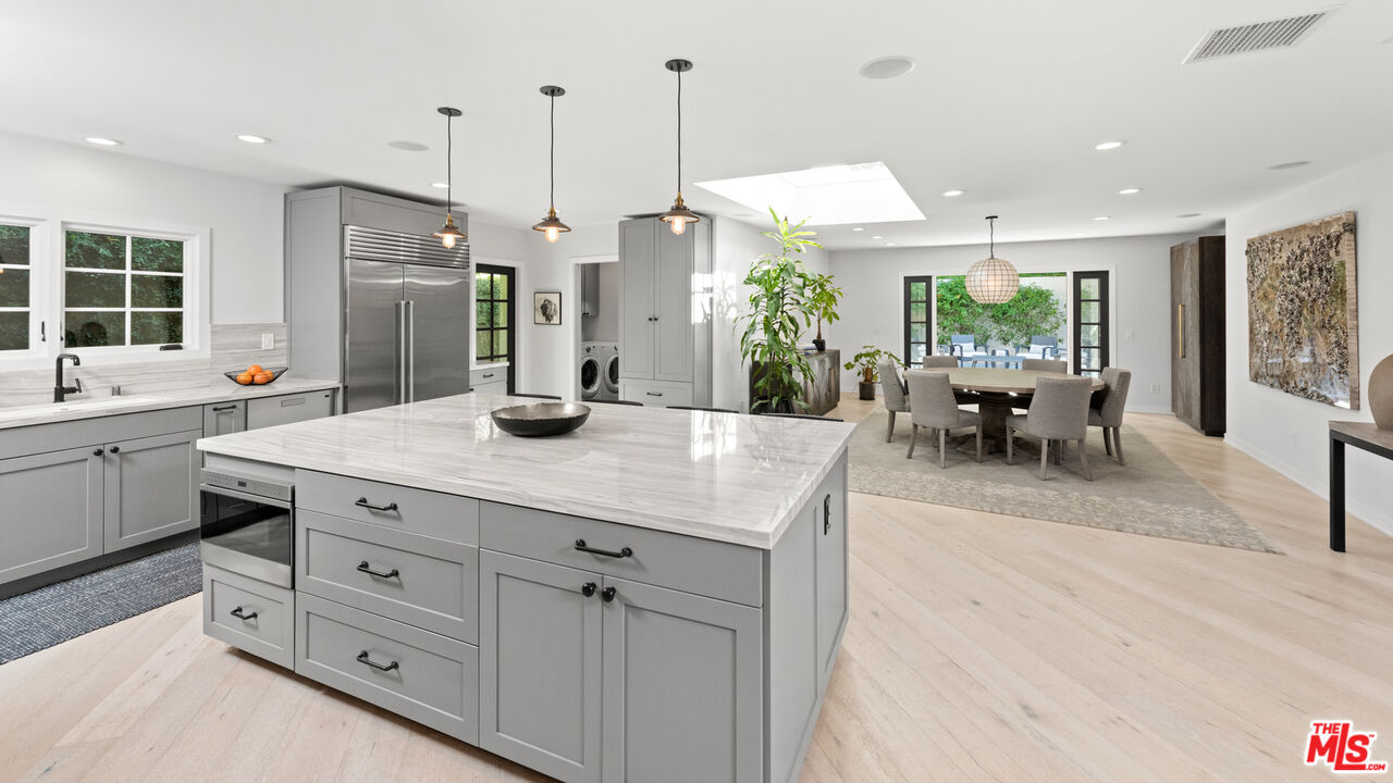 1944 North Beverly Drive Beverly Hills, CA 90210 - Photo 4 of 29 a kitchen with counter space and windows