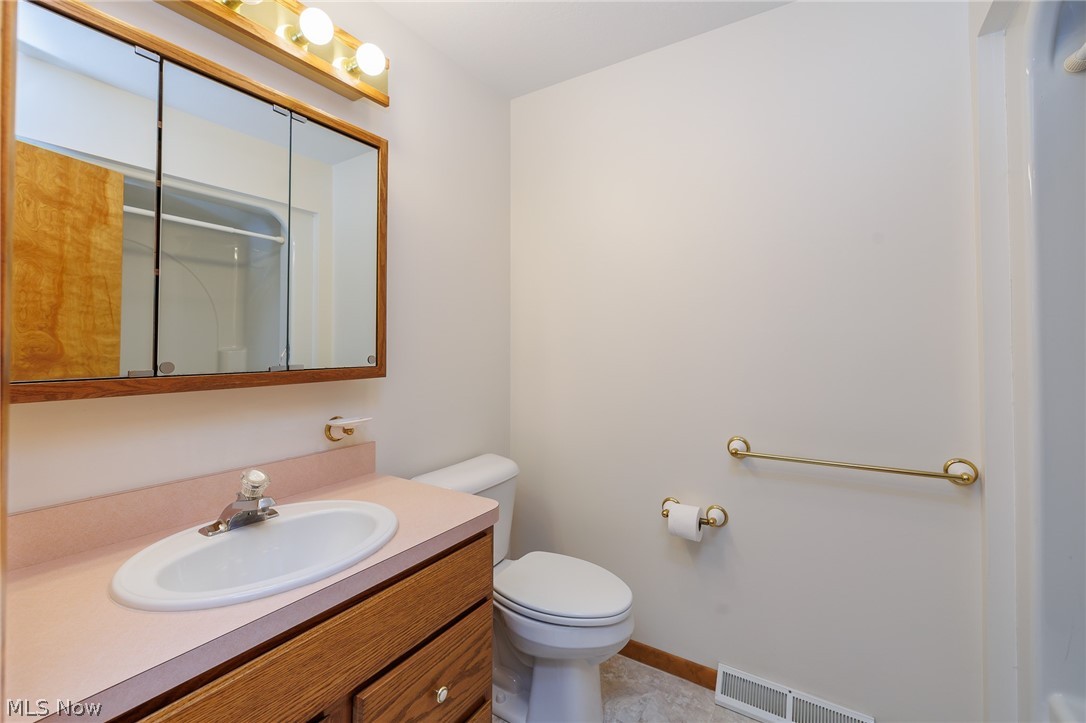 39816 Butternut Ridge Road Elyria, OH 44035 - Photo 23 of 45 Bathroom with vanity, toilet, and tile patterned flooring