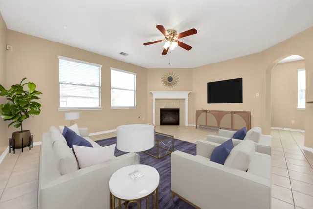 a spacious bathroom with a tub sink and mirror