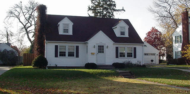1044 8th Street Rochelle, IL 61068 - Photo 1 of 1 a front view of a house with a garden