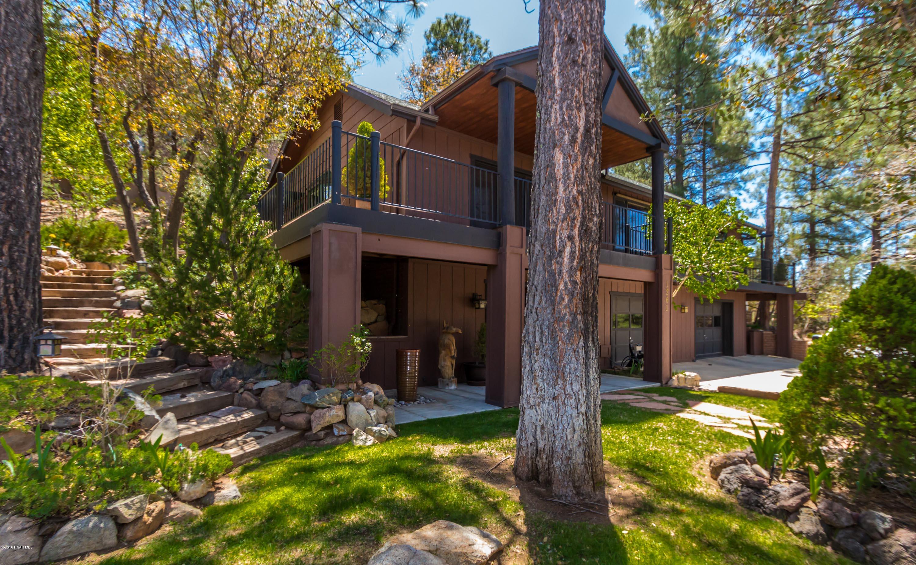 1261 Tanglewood Road Prescott, AZ 86303 - Photo 1 of 36 a view of a house with a yard