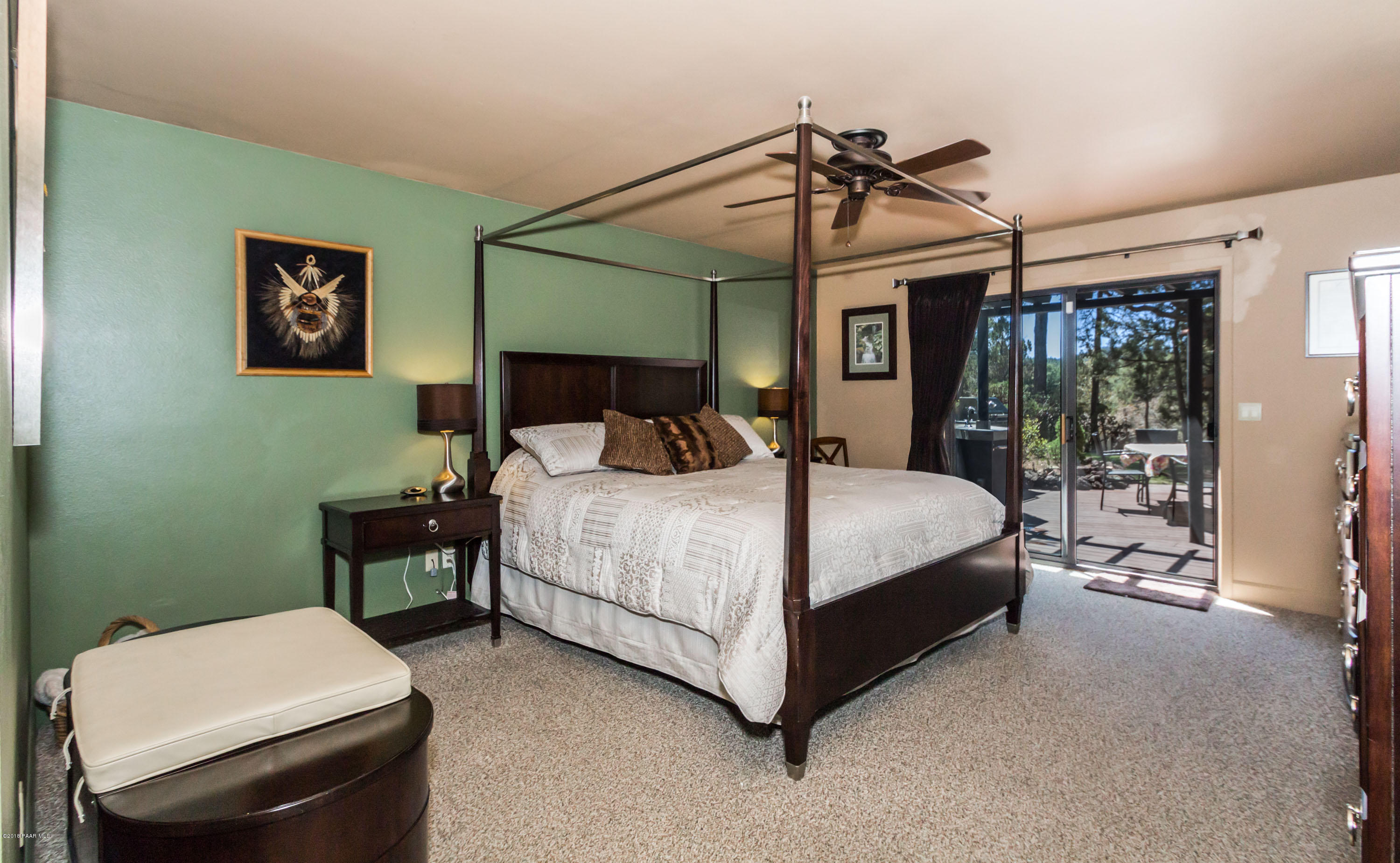 1261 Tanglewood Road Prescott, AZ 86303 - Photo 11 of 36 a bedroom with a bed a table and chair