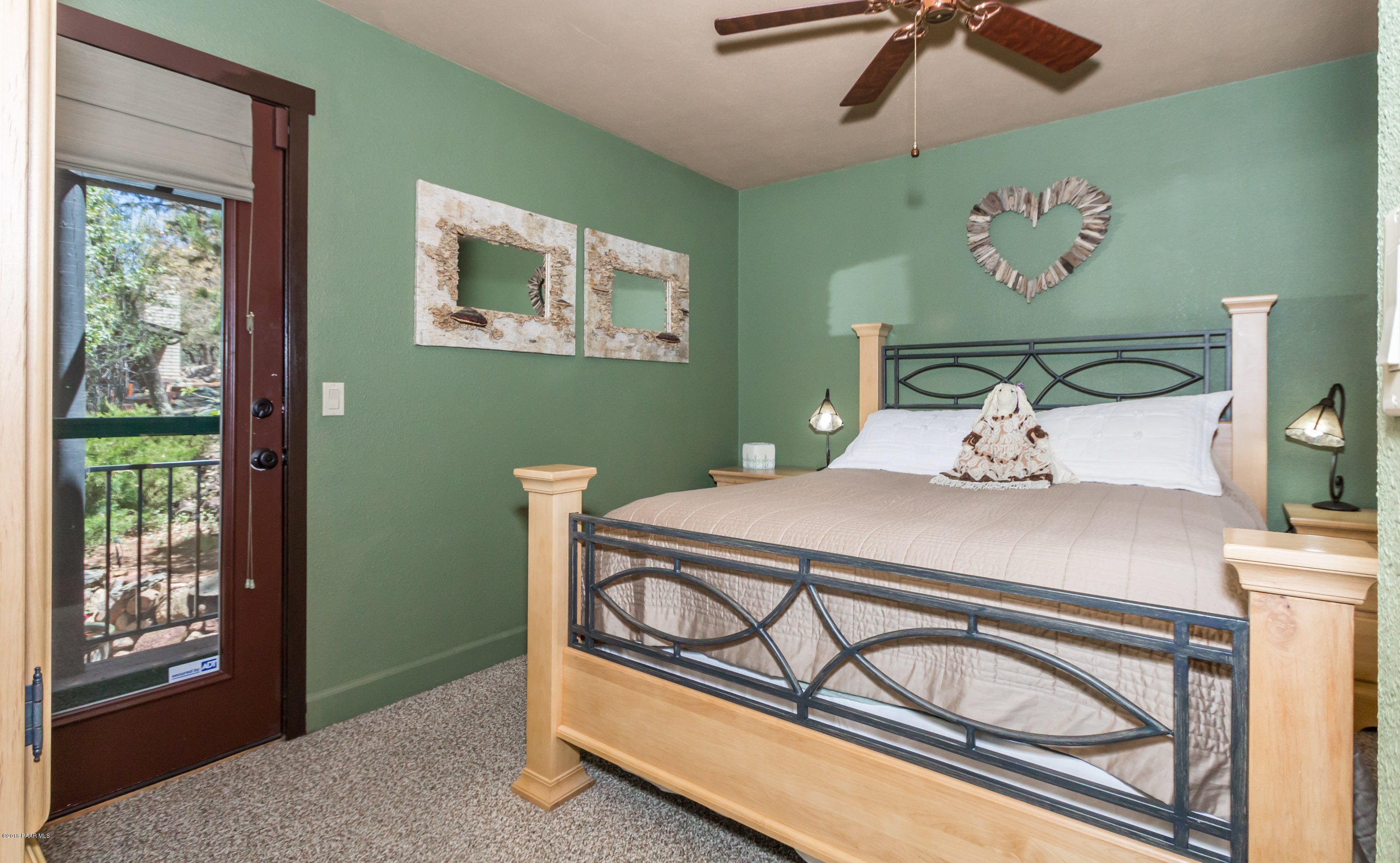 1261 Tanglewood Road Prescott, AZ 86303 - Photo 14 of 36 a bedroom with a bed and wooden floor