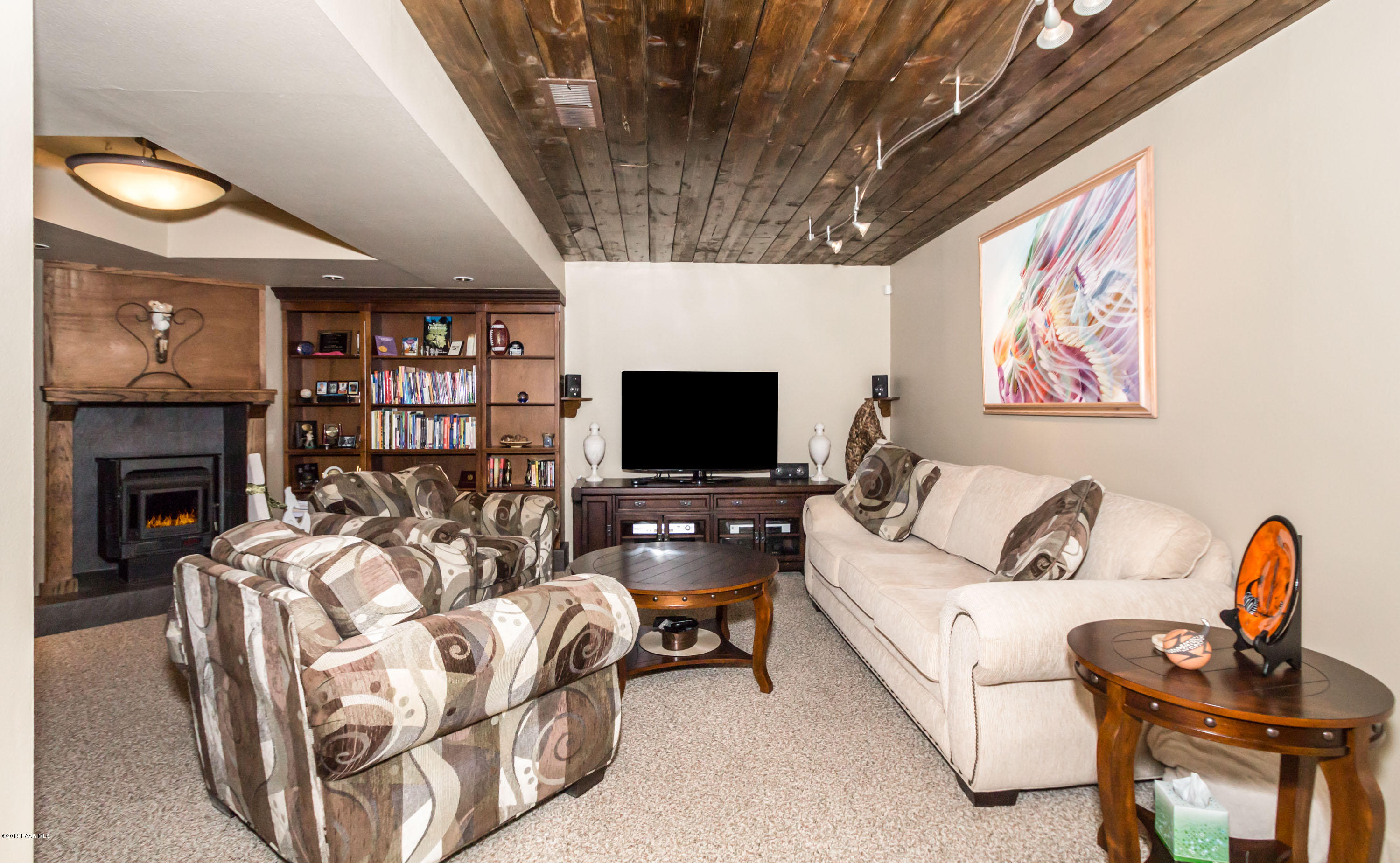 1261 Tanglewood Road Prescott, AZ 86303 - Photo 18 of 36 a living room with furniture and a flat screen tv