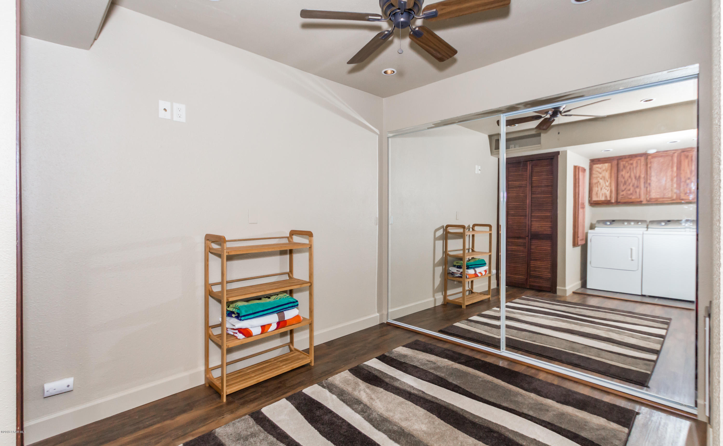 1261 Tanglewood Road Prescott, AZ 86303 - Photo 22 of 36 a view of a hallway with wooden floor and stairs