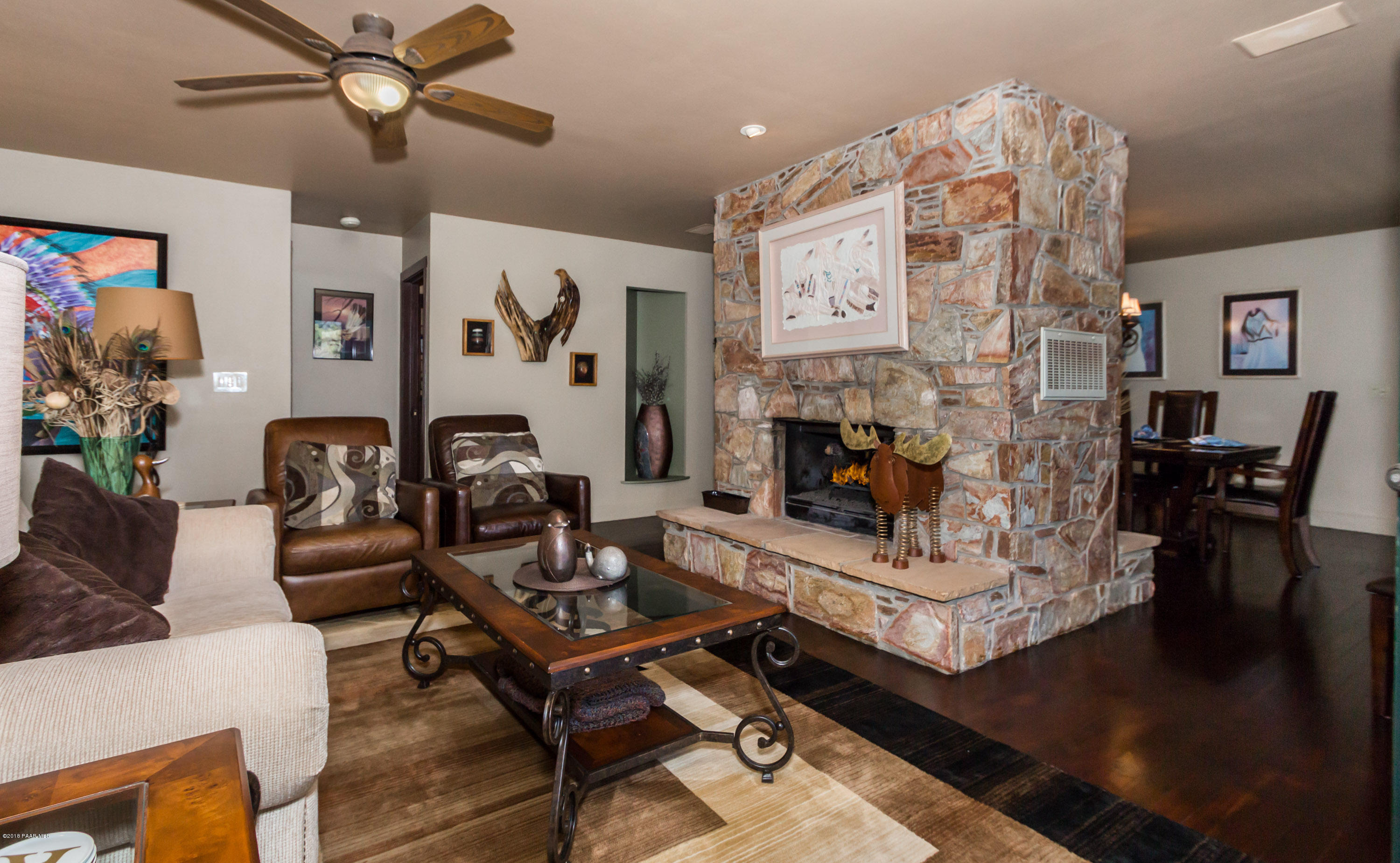 1261 Tanglewood Road Prescott, AZ 86303 - Photo 5 of 36 a living room with furniture and a fireplace