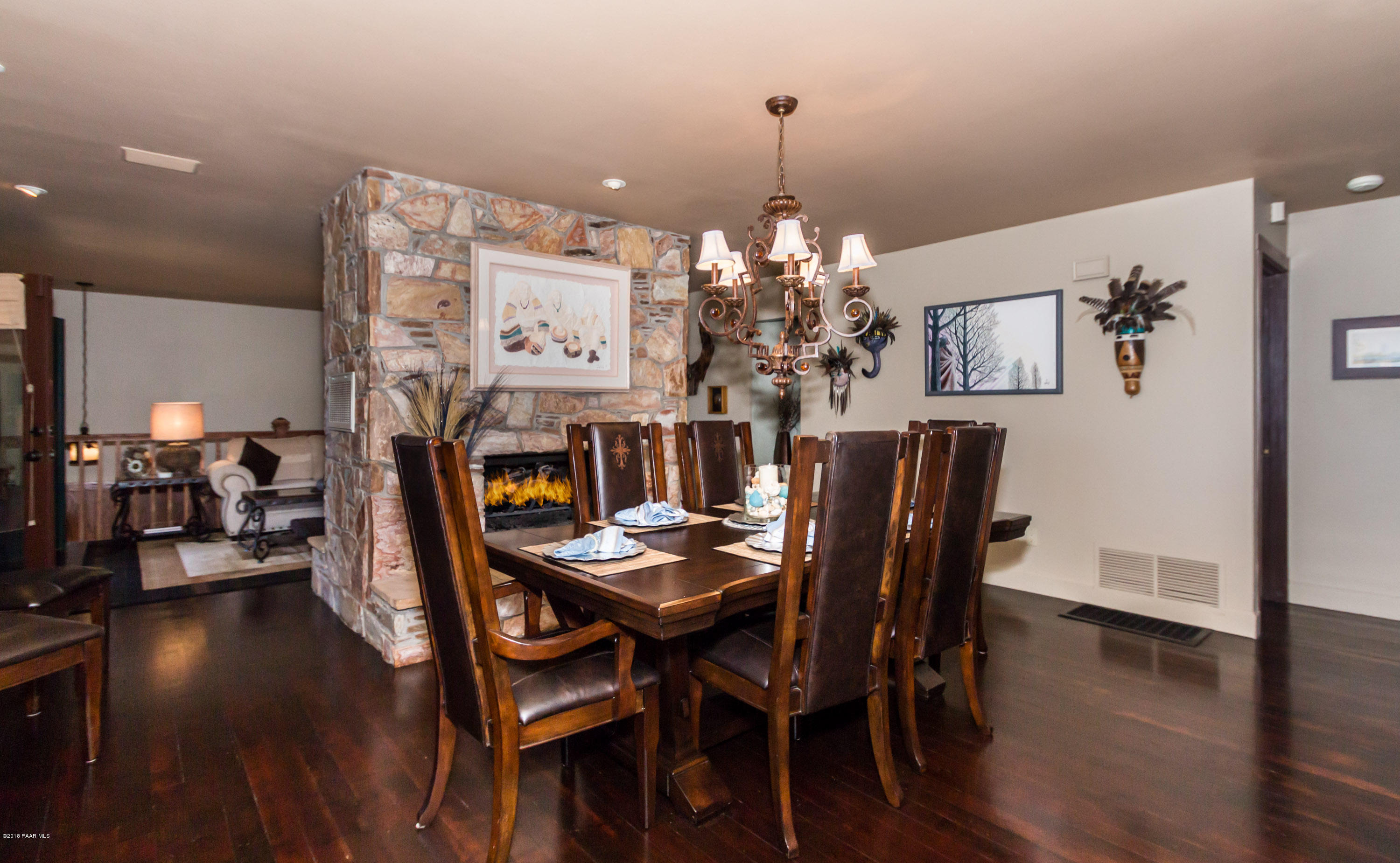 1261 Tanglewood Road Prescott, AZ 86303 - Photo 6 of 36 a view of a dining room with furniture and wooden floor