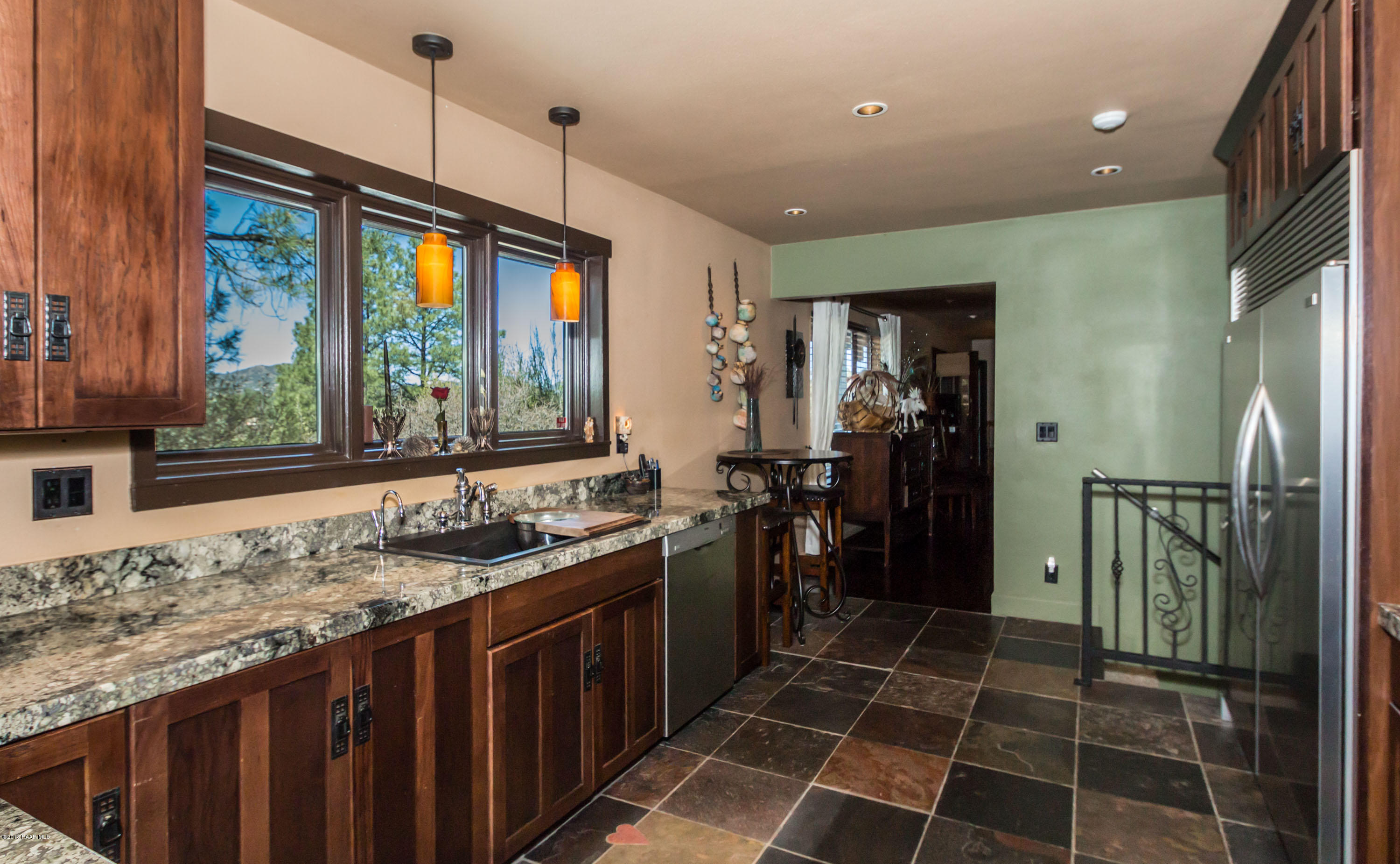 1261 Tanglewood Road Prescott, AZ 86303 - Photo 8 of 36 a kitchen with a sink a refrigerator and a sink