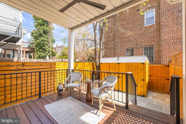 a view of a balcony with wooden floor