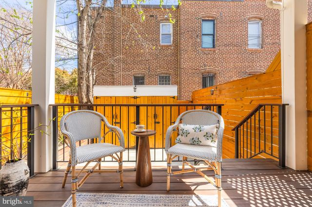 a building outdoor space with wooden benches