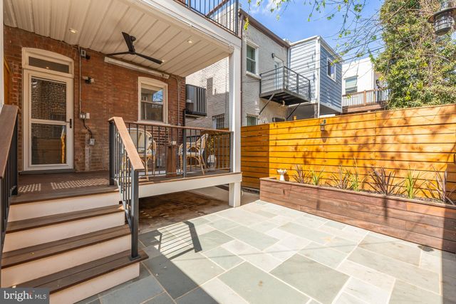 a view of a brick building with many windows