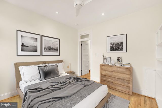 a bedroom with a bed and a cabinets
