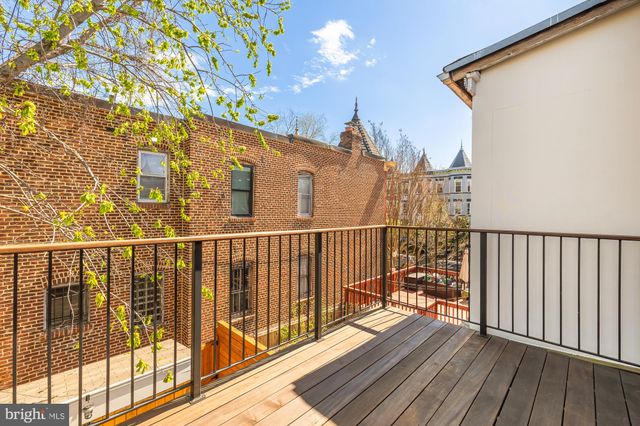 a view of balcony with wooden floor
