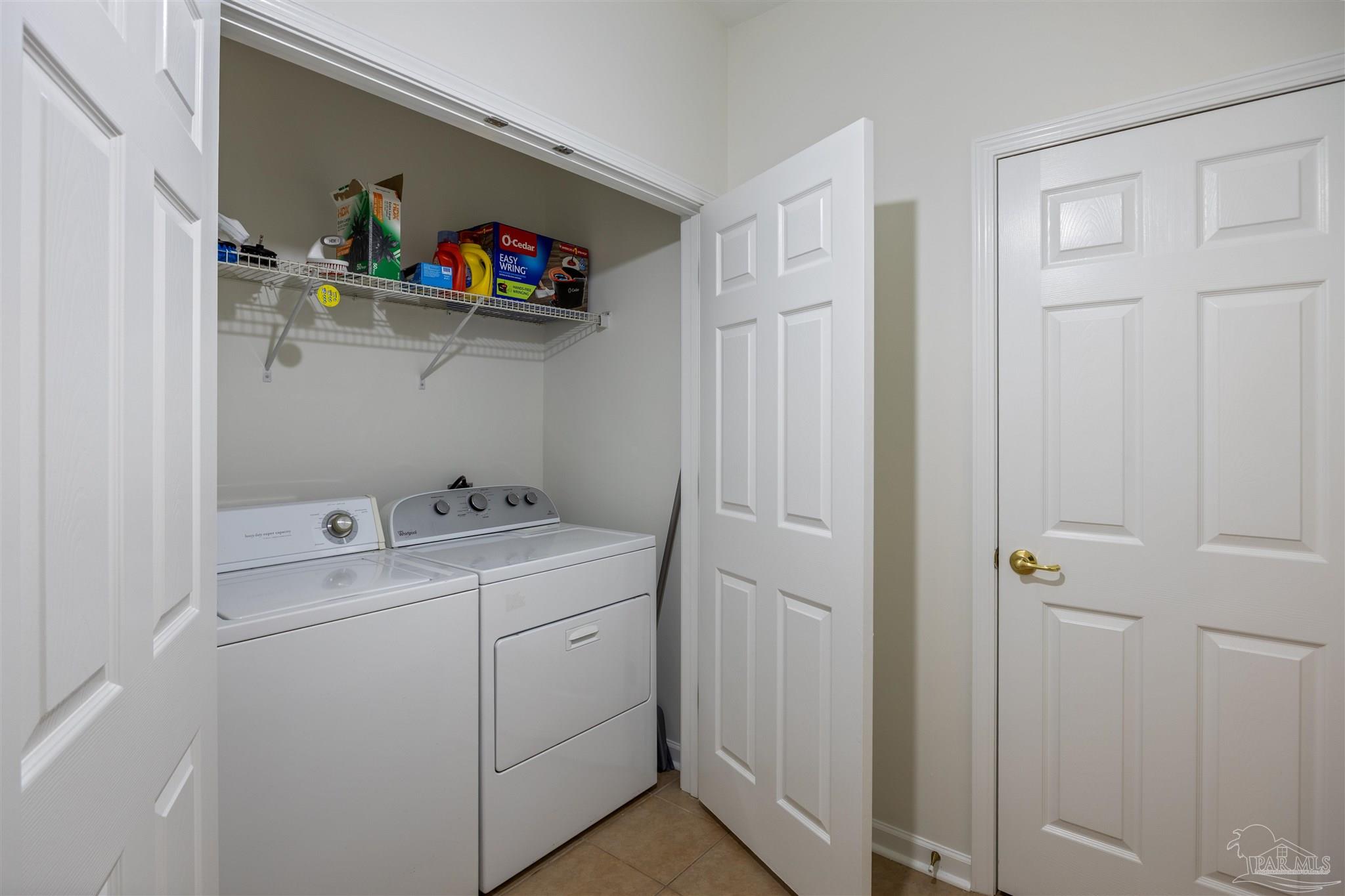6887 Crimson Ridge Street Gulf Shores, AL 36542 - Photo 29 of 37 a utility room with dryer and washer