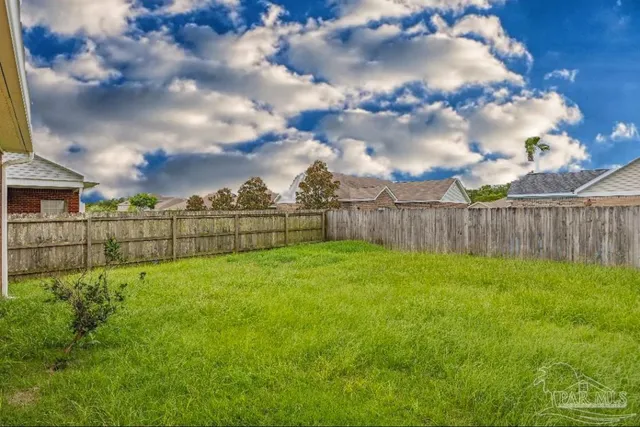 a view of a brick house with a large window