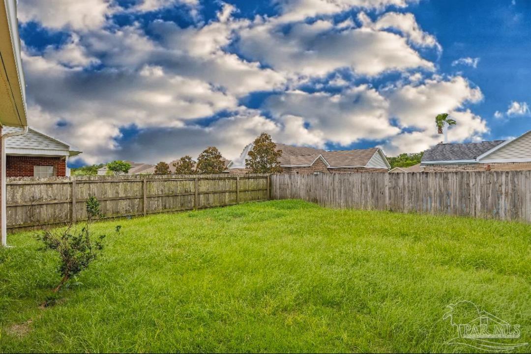 6887 Crimson Ridge Street Gulf Shores, AL 36542 - Photo 33 of 37 a view of a backyard
