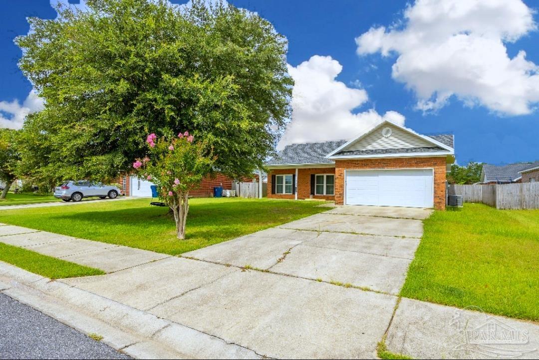 6887 Crimson Ridge Street Gulf Shores, AL 36542 - Photo 35 of 37 a front view of house with yard and green space