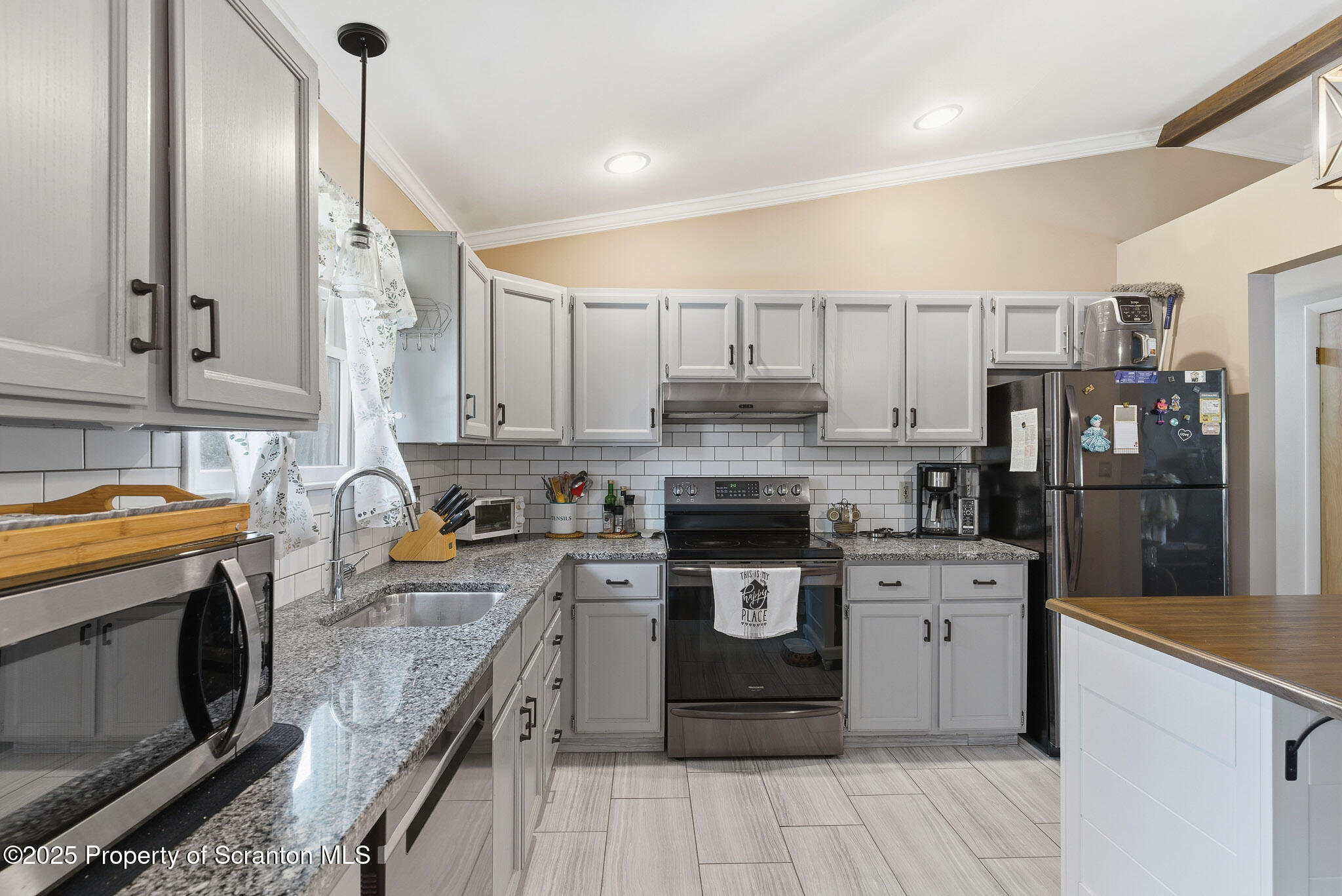 105 Fern Way Clarks Summit, PA 18411 - Photo 11 of 40 a kitchen with stainless steel appliances granite countertop a stove top oven a sink dishwasher and a refrigerator with wooden cabinets