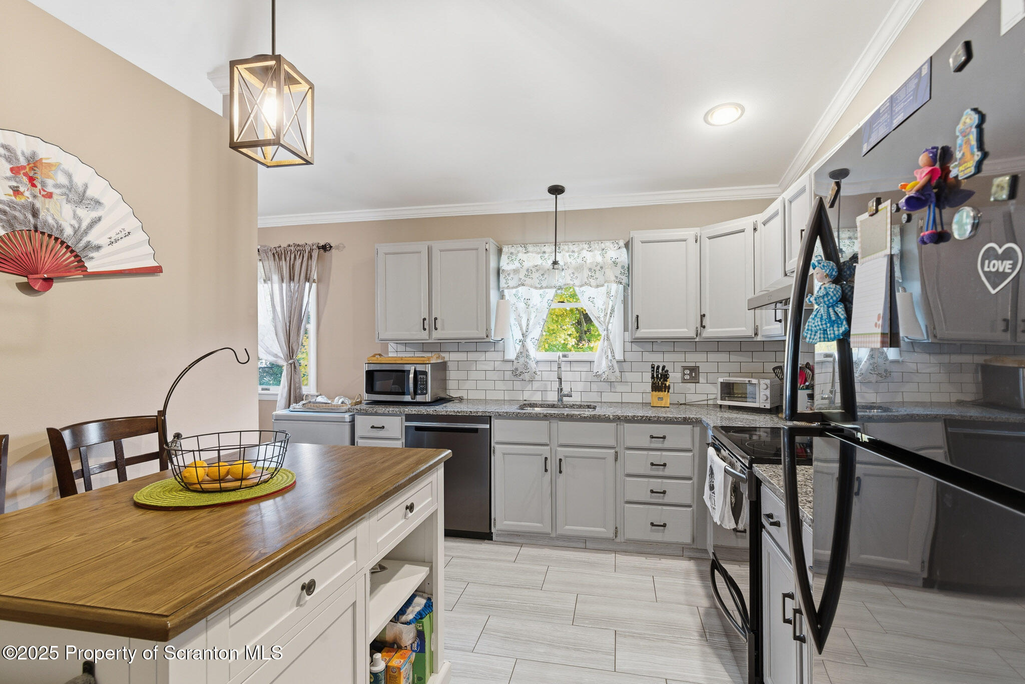 105 Fern Way Clarks Summit, PA 18411 - Photo 14 of 40 a kitchen with a sink a stove and chairs