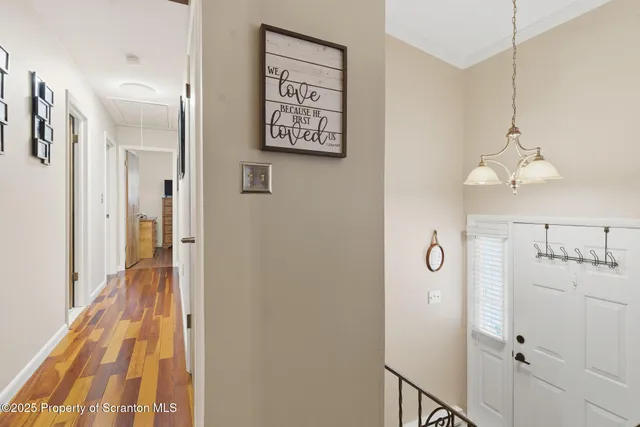 a view of a hallway with a chandelier
