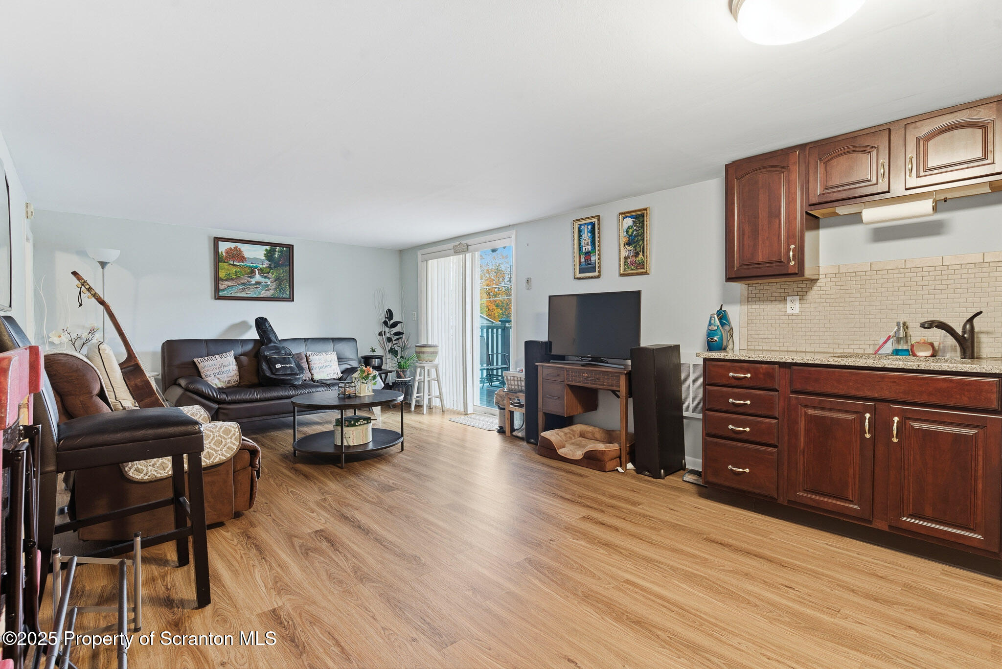 105 Fern Way Clarks Summit, PA 18411 - Photo 25 of 40 a living room with furniture flat screen tv and fireplace