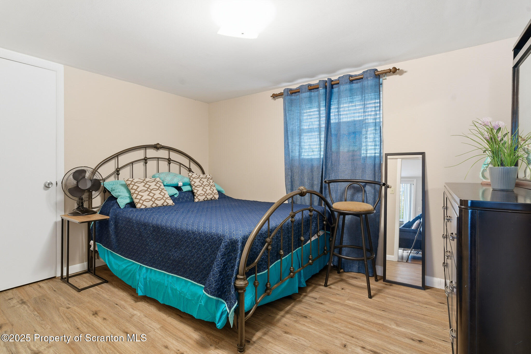 105 Fern Way Clarks Summit, PA 18411 - Photo 28 of 40 a bedroom with a bed table flowerpot and a window