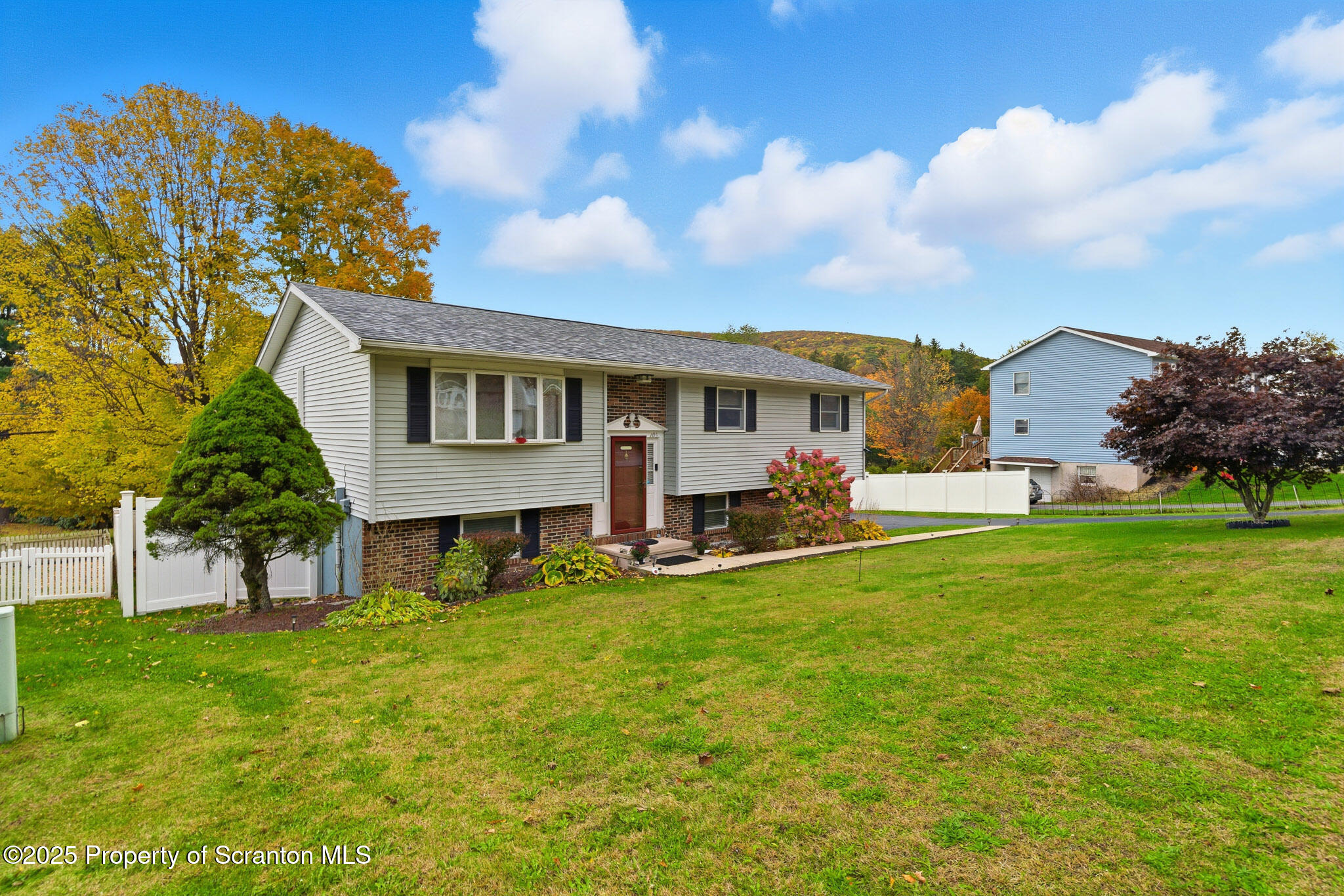 105 Fern Way Clarks Summit, PA 18411 - Photo 3 of 40 a view of a house with a backyard porch and sitting area