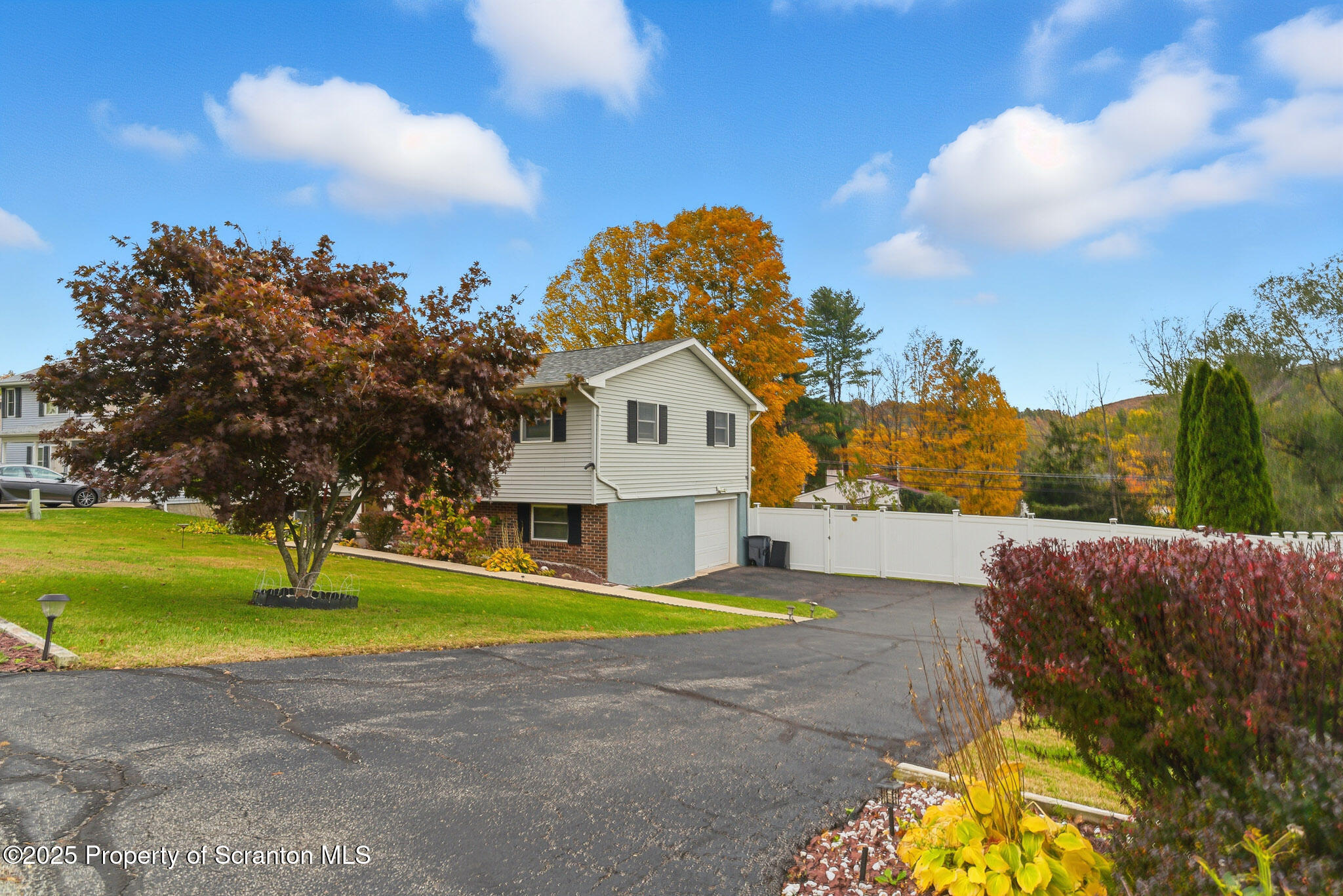 105 Fern Way Clarks Summit, PA 18411 - Photo 4 of 40 a view of a house with a big yard and large trees