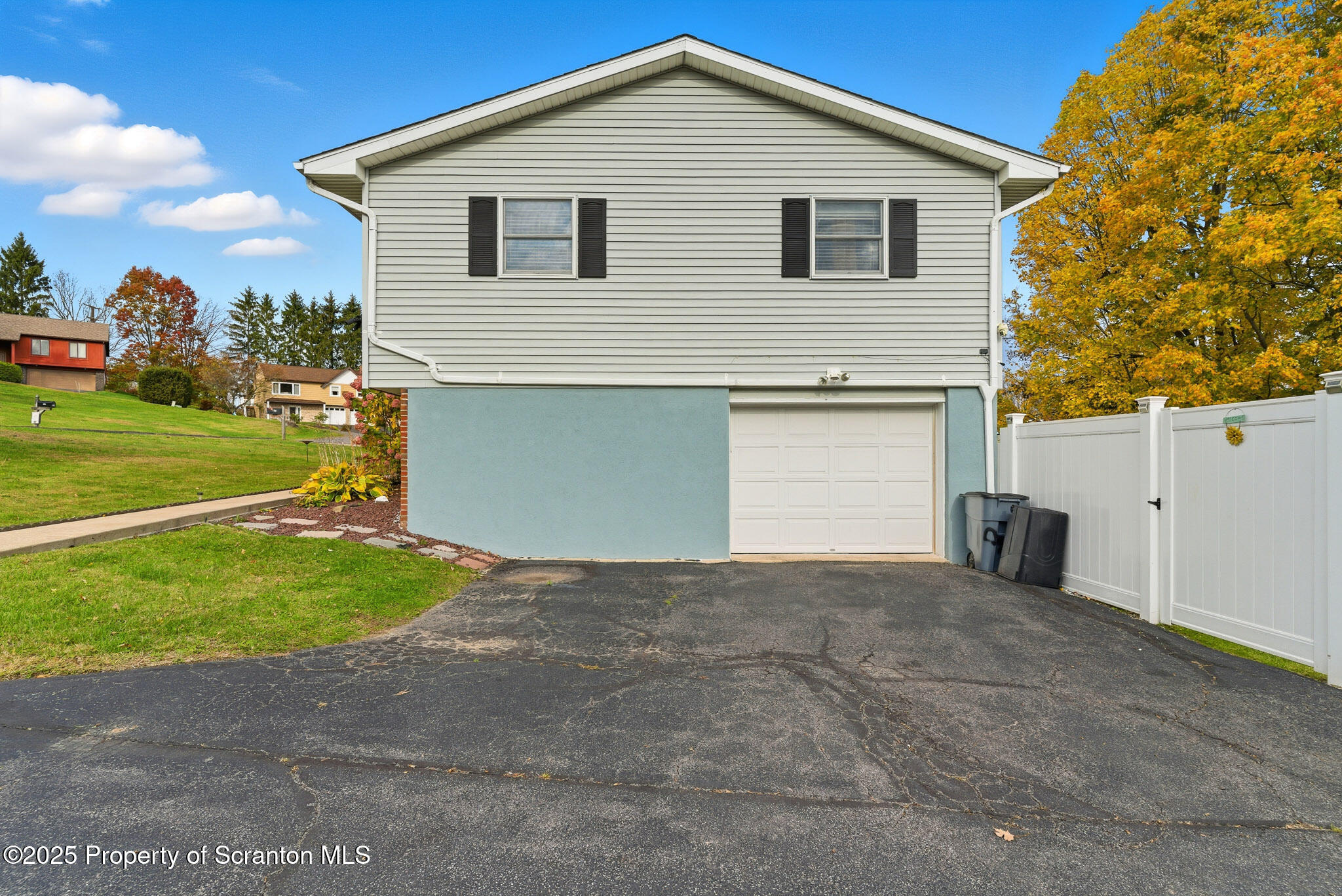 105 Fern Way Clarks Summit, PA 18411 - Photo 5 of 40 a view of a white house next to yard and road