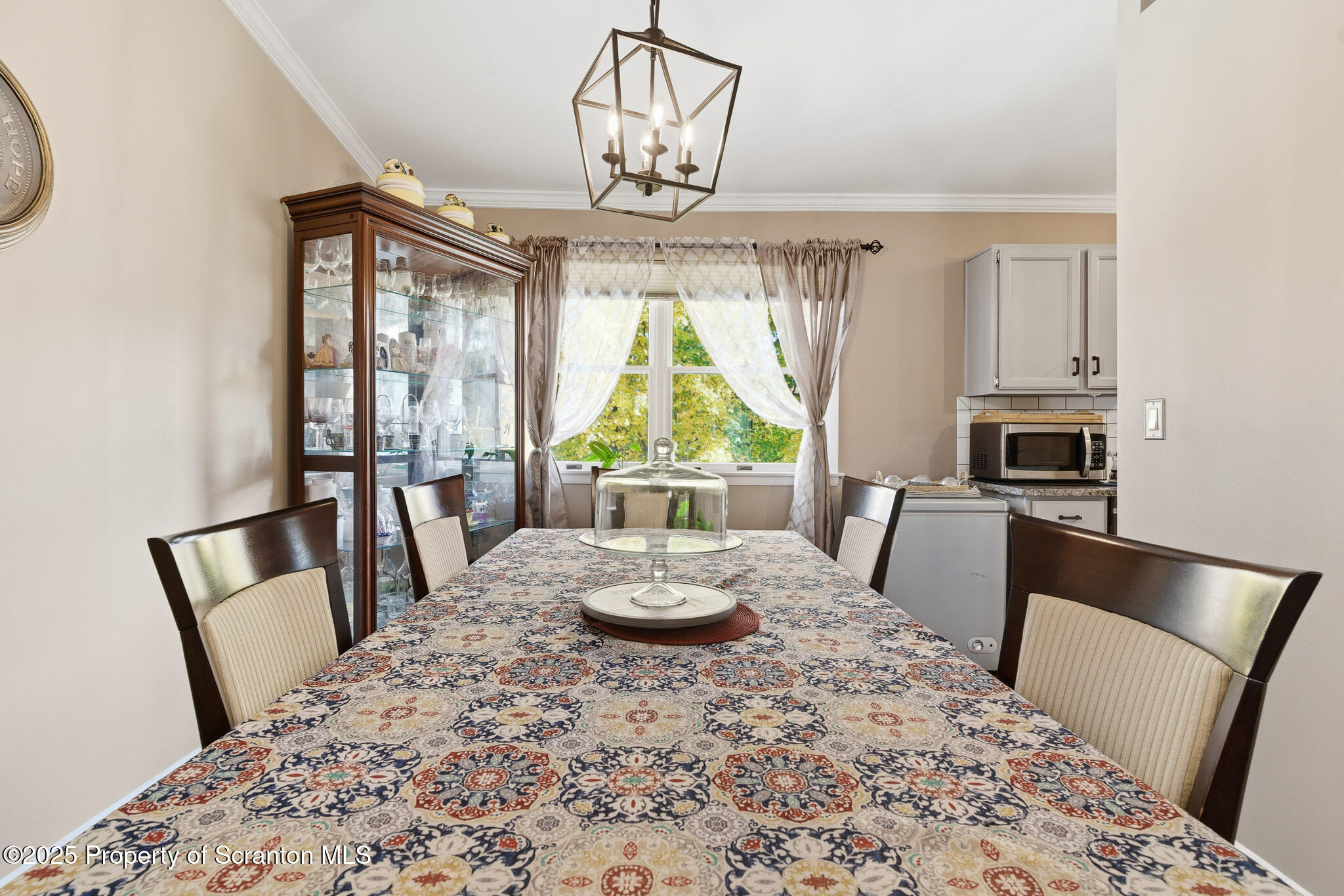 105 Fern Way Clarks Summit, PA 18411 - Photo 9 of 40 a view of a dining room with furniture a chandelier and wooden floor