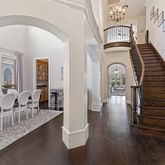 wooden floor with a dining table & chairs in a room