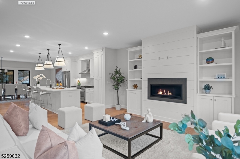 147 Center Avenue, Unit 17 Old Tappan, NJ 07675 - Photo 2 of 48 a living room with furniture and a fireplace