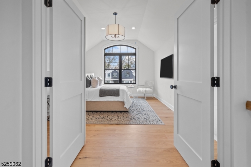 147 Center Avenue, Unit 17 Old Tappan, NJ 07675 - Photo 21 of 48 a living room with furniture and a flat screen tv
