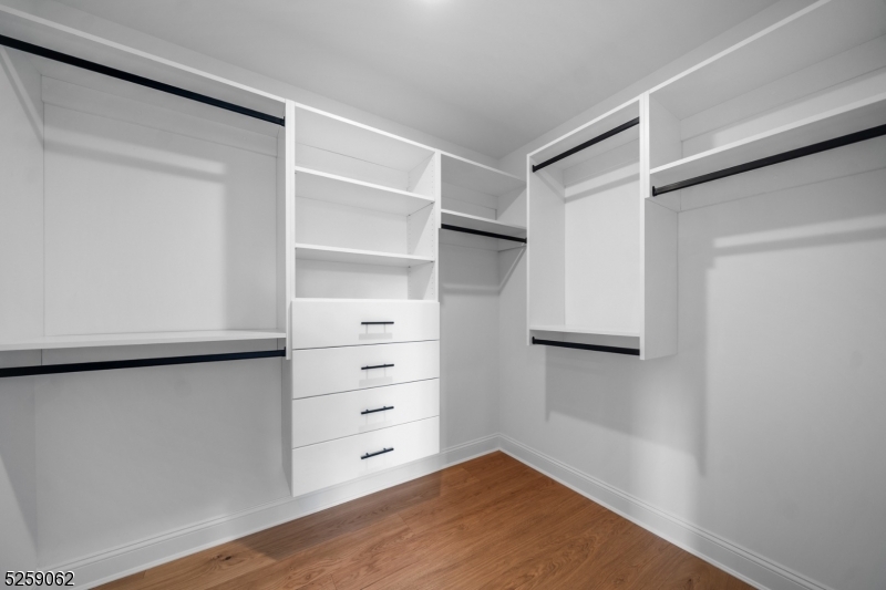 147 Center Avenue, Unit 17 Old Tappan, NJ 07675 - Photo 25 of 48 a view of walk in closet with empty racks